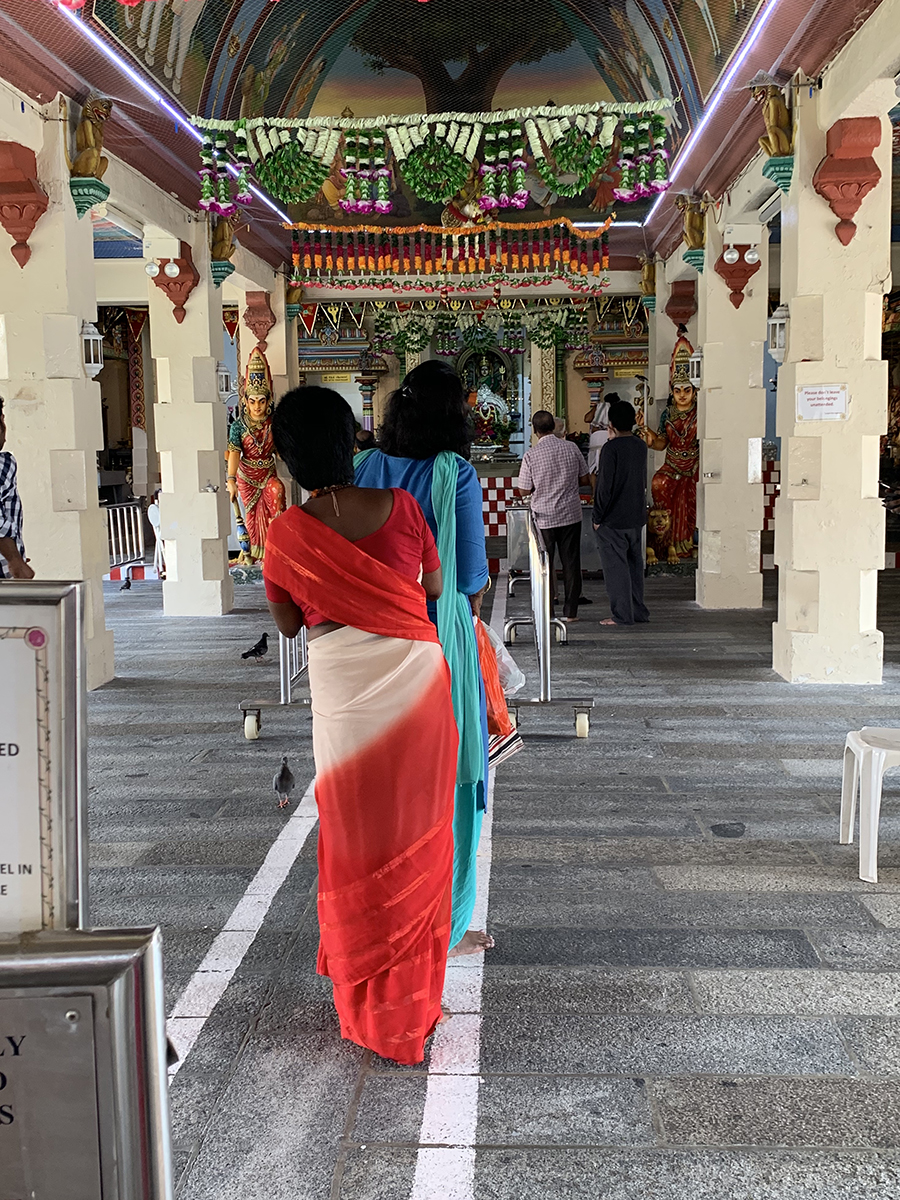 Ladies inside of the Sri Mariamman Temple.